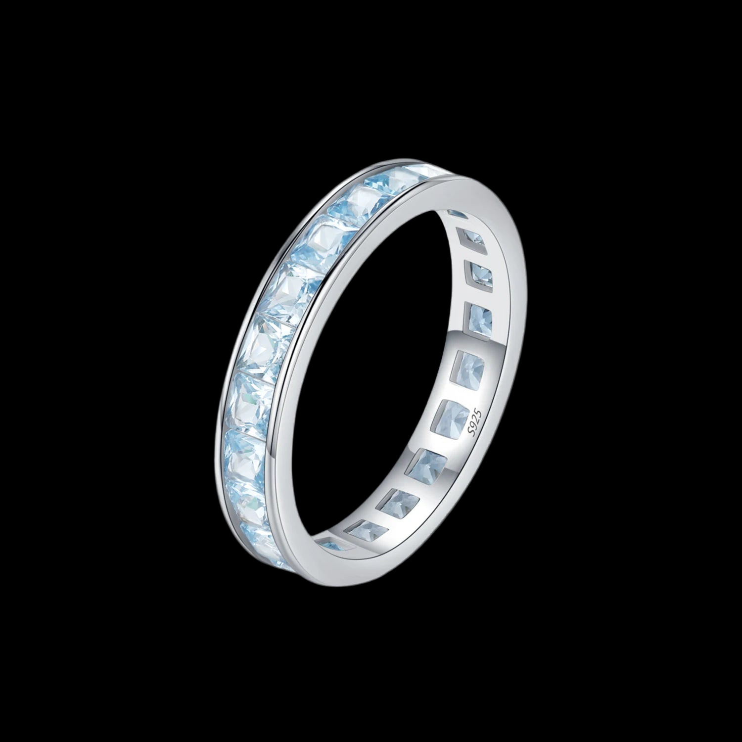 Silver ring with blue gemstones on a black background