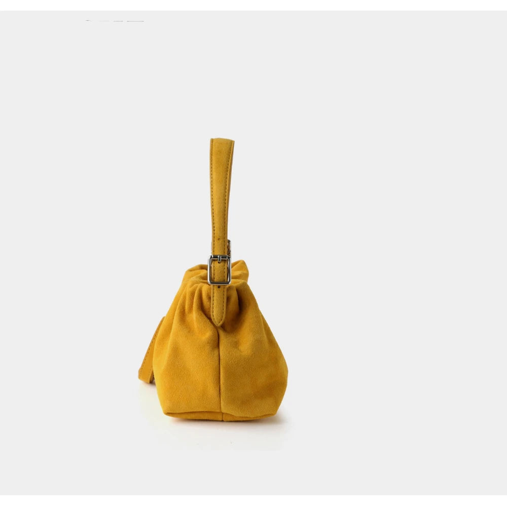 Yellow handbag on a white background with 'PASTE' branding.