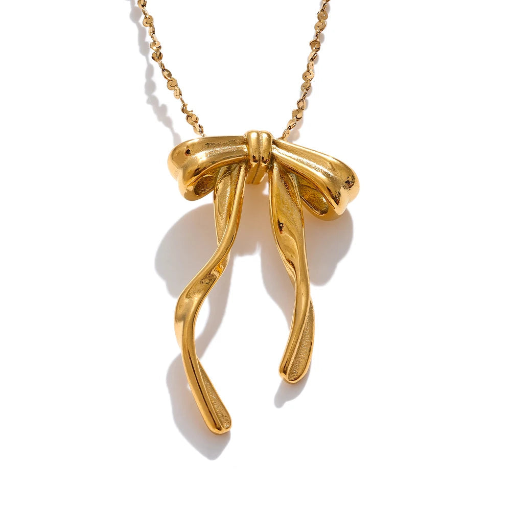 Gold bow-shaped pendant on a chain