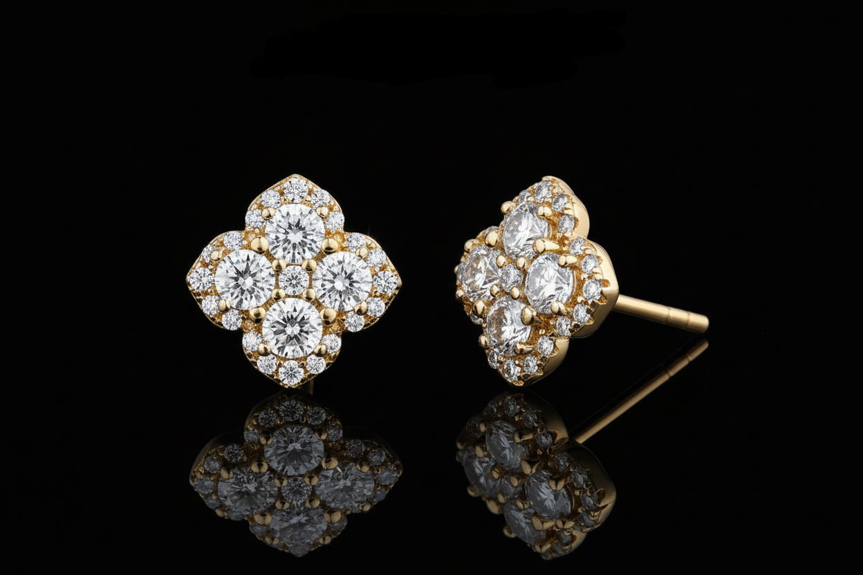 Gold and diamond earrings with 'Atta Gems' branding on a white background