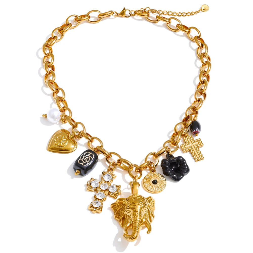 Gold bracelet with various charms on a white background