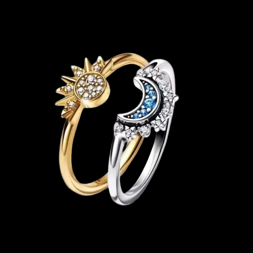 ring with star and moon designs on a black background.