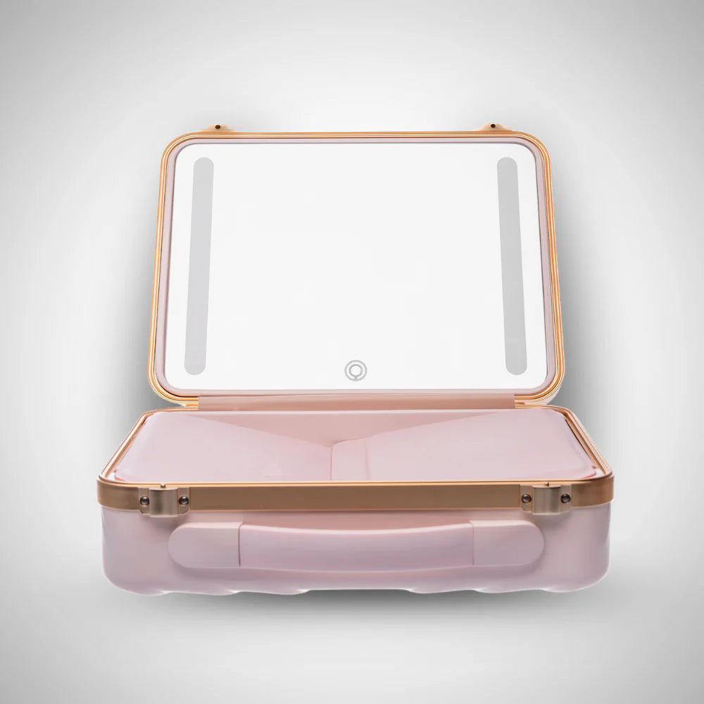 Pink makeup case with gold accents on a light gray background