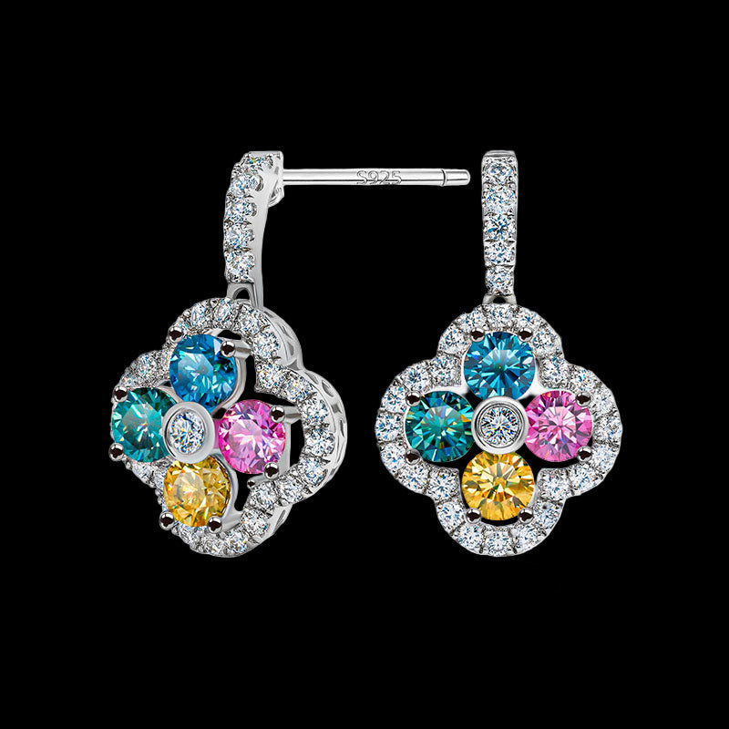 Pair of earrings with colorful gemstones on a white background