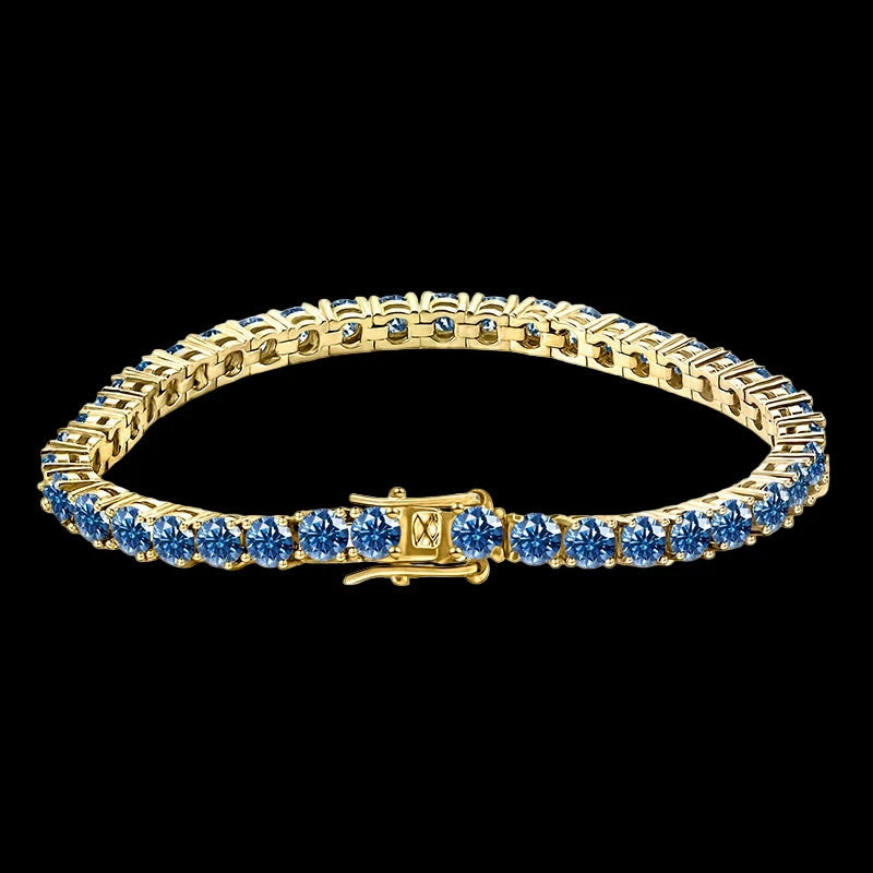 Gold bracelet with blue stones on a white background