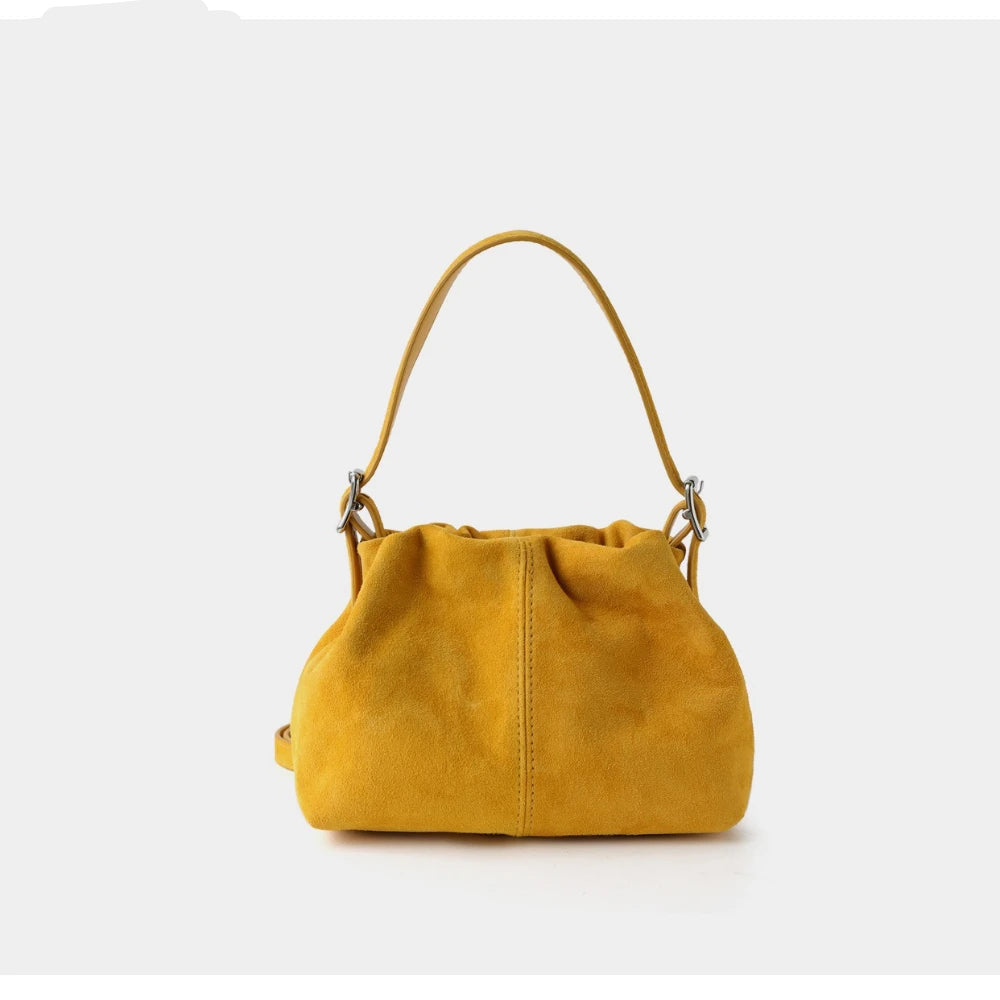 Yellow handbag on a white background with 'PASTE' branding.