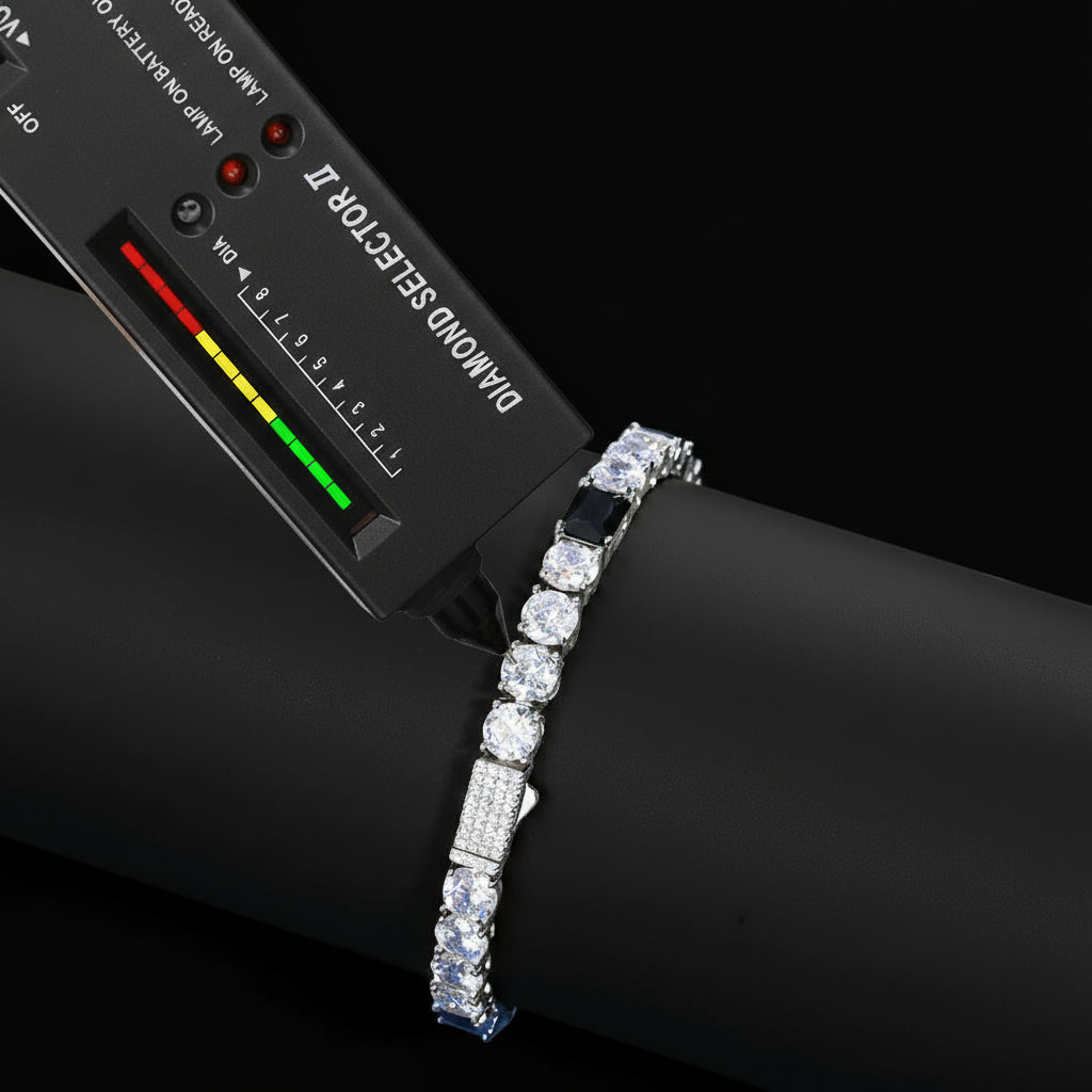 Diamond bracelet with a diamond selector tool on a blue surface