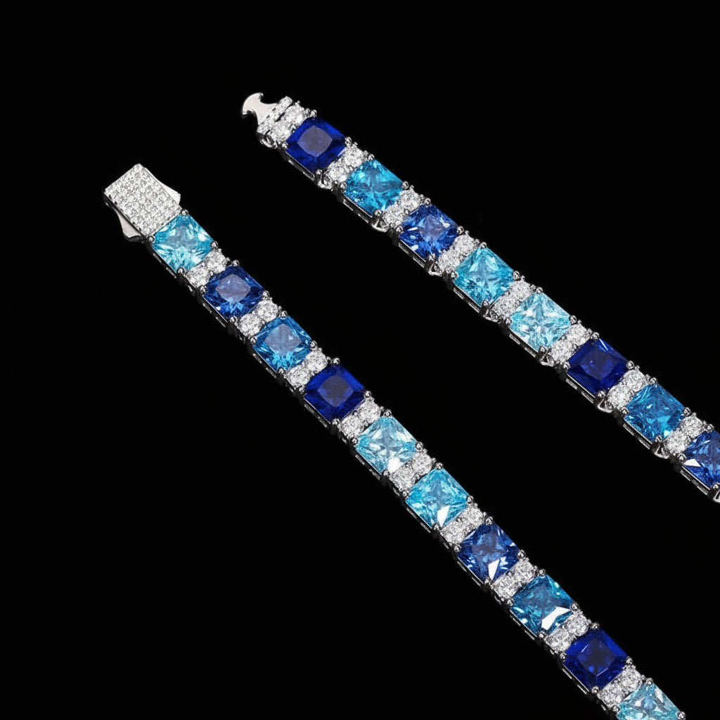 Jewelry set with blue gemstones on a blue background
