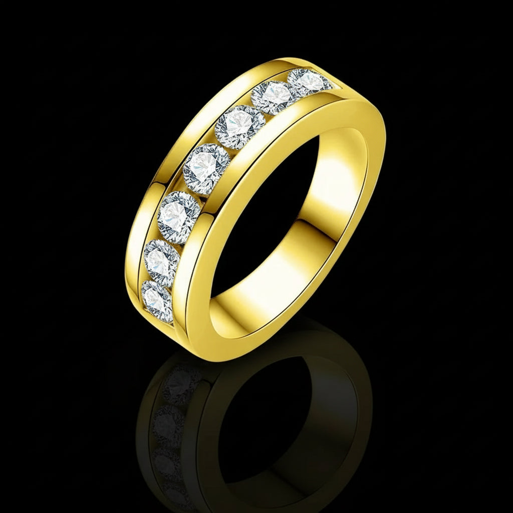 Gold ring with clear gemstones on a white background