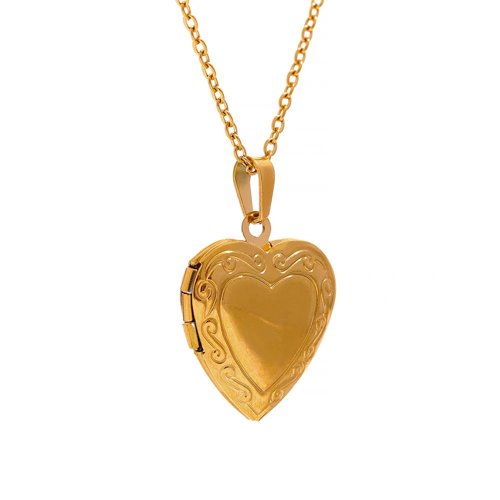 Gold heart-shaped locket on a white background 