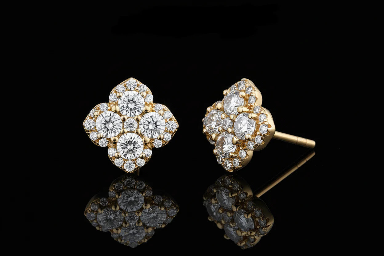 Gold and diamond earrings with 'Atta Gems' branding on a white background