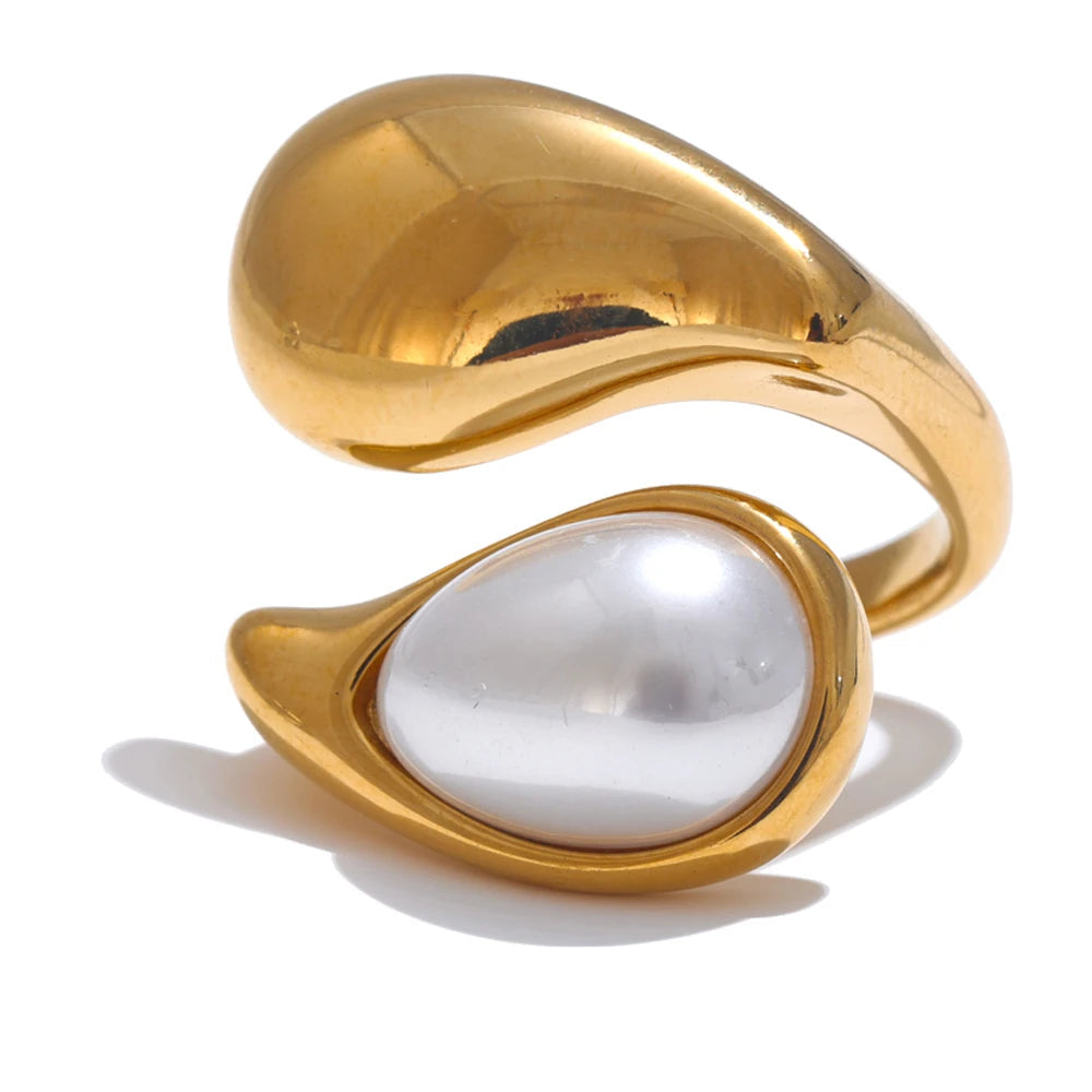 Gold ring with a pearl on a white background