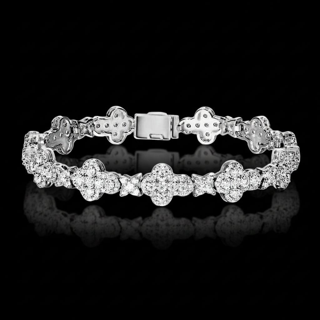 Silver bracelet with floral designs on a black background