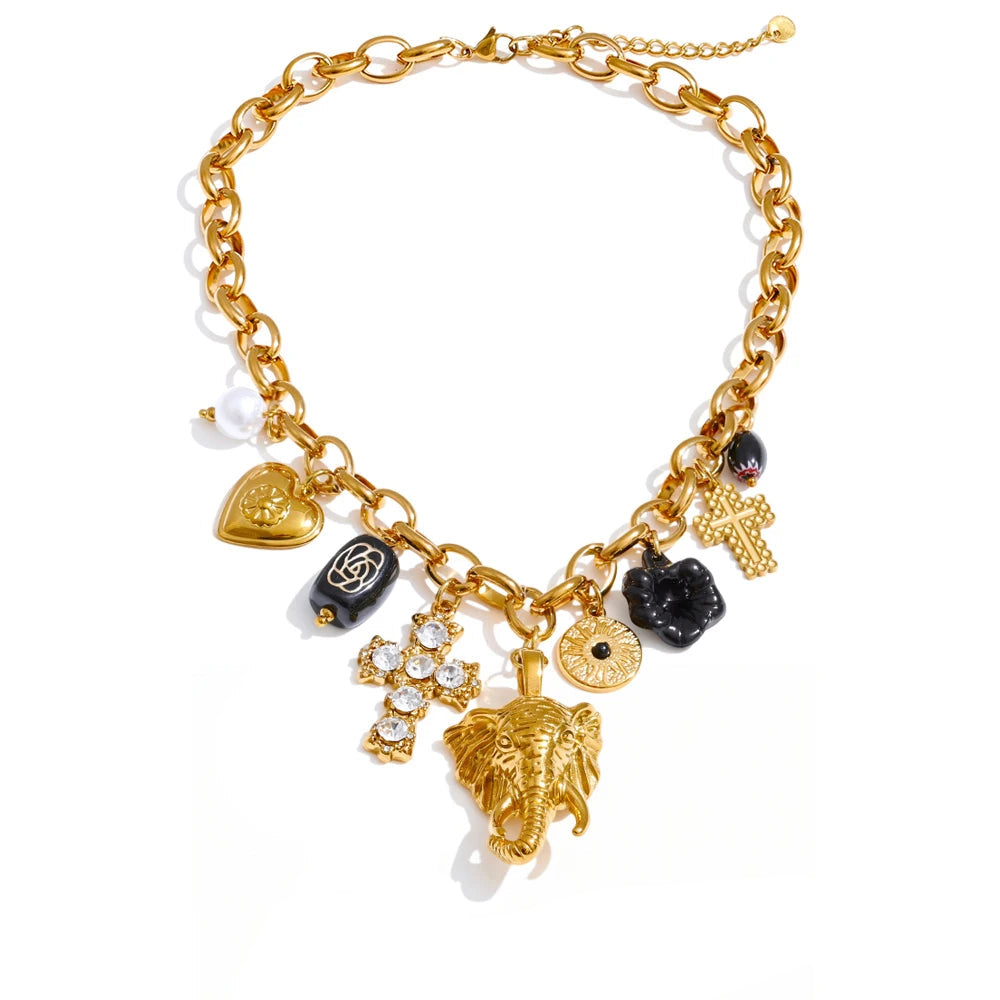 Gold bracelet with various charms on a white background